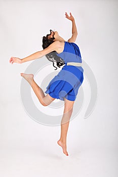 Modern dance of pretty teenage girl in blue dress