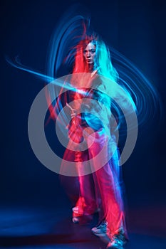 Modern dancer in neon light