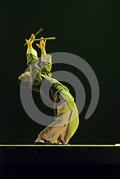 Modern dancer performs solo dance on stage