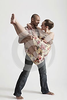 Modern Dancers Performing Over White Background