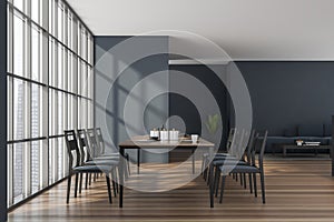 Modern dark blue dining room with a sofa