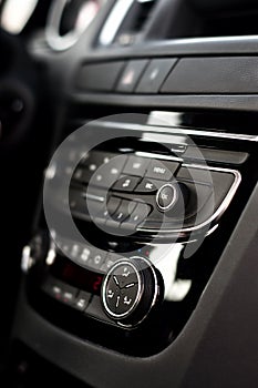 Modern dashboard with clima controls in car interior photo