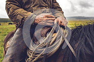 A modern-day cowboy saddles up for ranch work