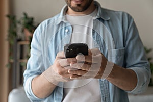 Modern day millennial man confident internet user hold new smartphone photo