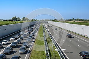 Modern deepened motorway A4 close to Rotterdam, Netherlands., Traffic jam direction Rotterdam Netherlands