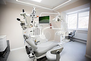 Modern Dental Clinic, Dentist chair and other accessories used by dentists in medical light. Dental surgeon, is a