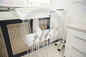 Modern dental equipment in while light dental office interior. Dentistry. Medical clinic. Outpatient hospital. Ad space