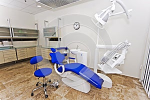 Modern dentist's chair in a medical room.