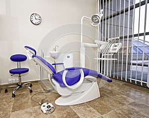 Modern dentist's chair in a medical room.