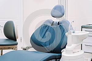 Modern dentistry clinic. Dental chair and tools for treatment and surgery of teeth. Dentist medical equipment.