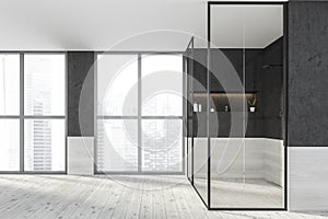 Modern design bathroom interior with shower cabin, faucets. Panoramic window with skyscrapers city view. Wood and concrete