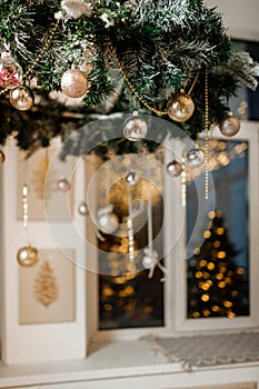 Modern design Christmas tree decorated with balls, toys and garlands. Christmas or New Year background.