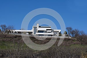 Modern design house. Against the background of the blue sky. Summer