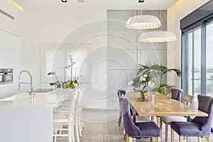 Modern Design Of Luxury White Kitchen With Marble Island And Dinner Table