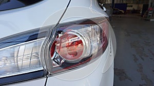 Modern design white sports car rear lights provide bright light for safe driving and traveling