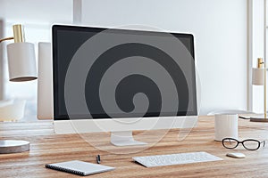 Modern designer desktop with empty computer screen