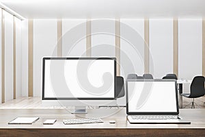 Modern designer office desktop with empty white mock up computer screens, supplies and interior background. 3D Rendering