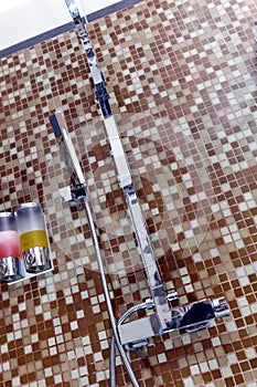 Modern designer tap and shower in bathroom