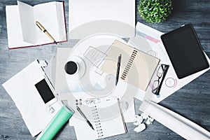 Modern desk with empty tablet and smartphone