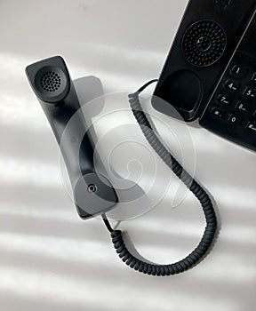 Modern desk telephone with white background
