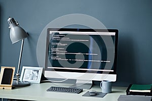 Modern Desktop Computer Displaying Programming Code in Minimalist Workspace