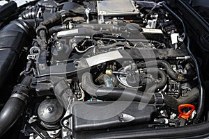 A modern diesel engine with 170 horsepower and an engine capacity of 2.2 liters. Visible engine equipment, spark plugs and electri