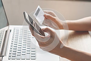 Modern digital financial lifestyles. person holding credit card and doing bank payment via internet by computer