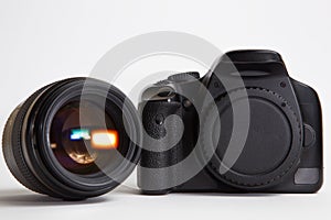 Modern digital photo camera with 85 mm photo lens