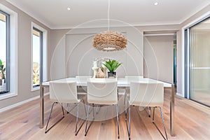 Modern dining room design with table set up and natural decorations