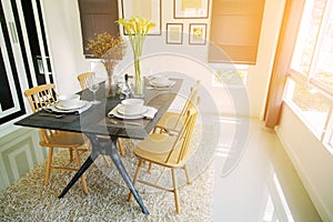 Modern dining room interior with warm light from the sun. Relax day in dining room on free day and no activity.