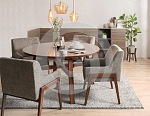 Modern dining room set with gray chairs and a wooden table with white plates on it