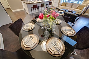 Modern dining room table set for dinner