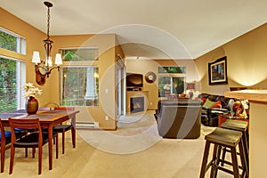Modern dinning room/ living room with carpet.