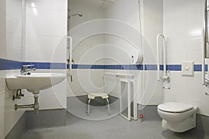 Modern disabled person bathroom wc with sink toilet and shower