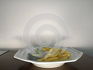 Modern dish - potatoes accompanied with sauce