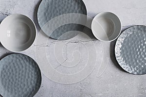 modern dishware collection in rustic grey and beige tones.