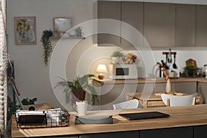 Modern domestic kitchen with gadgets on tble