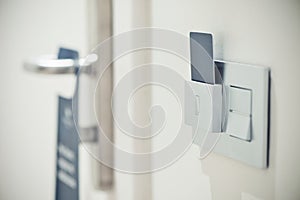 Modern door room with card key in hotel room