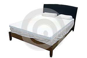 Modern double bed with cotton sheets and clipping path