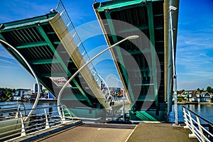 Modern Draw Bridge being opened at Zaandijk over the Zaan River photo