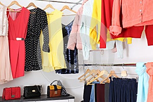 Modern dressing room with different stylish clothes