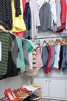 Modern dressing room with different stylish clothes