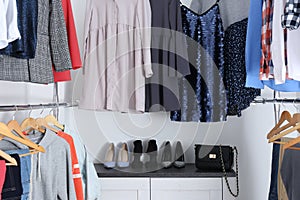 Modern dressing room with different stylish clothes