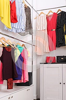 Modern dressing room with different stylish clothes