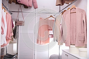 Modern dressing room with different stylish clothes