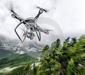 Modern drone flies in the mountains.