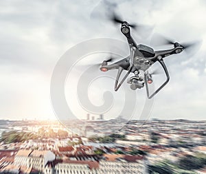 Modern drone in flight over the city.