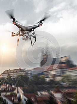 Modern drone in flight over the city.