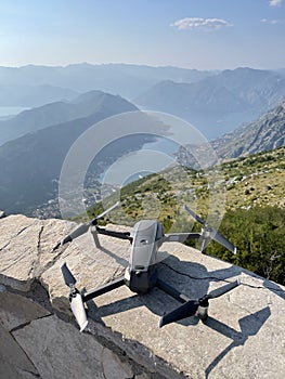 Modern drone while traveling against the backdrop of mountains