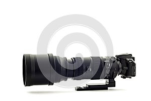 Modern DSLR Camera With Super Telephoto Zoom Lens On White